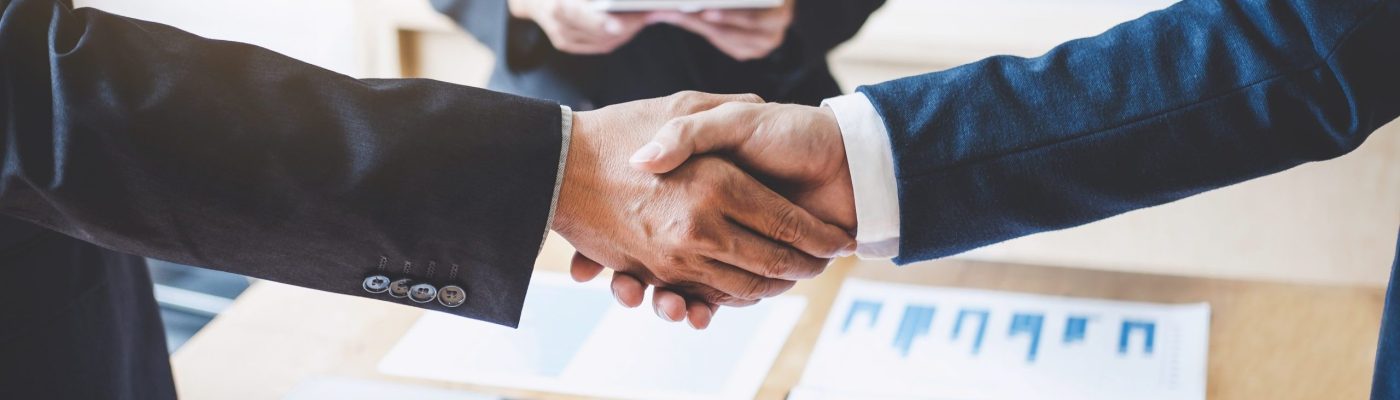 Finishing up a meeting, Business shaking hands after discussing good deal of Trading to sign agreement and become a partner, contract for both companies, Successful businessman handshake.